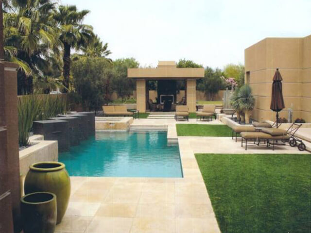 Luxury pool surrounded by lush greenery