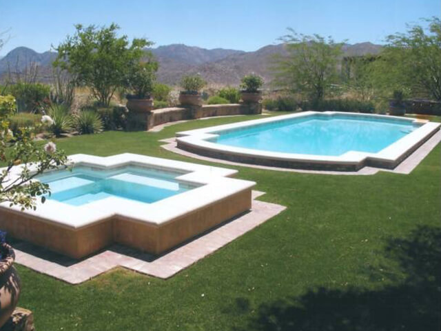Swimming pool surrounded by tropical landscaping